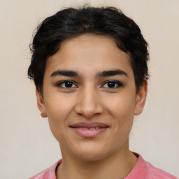 Joyful latino young-adult female with short  brown hair and brown eyes