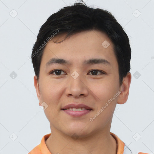 Joyful asian young-adult male with short  black hair and brown eyes