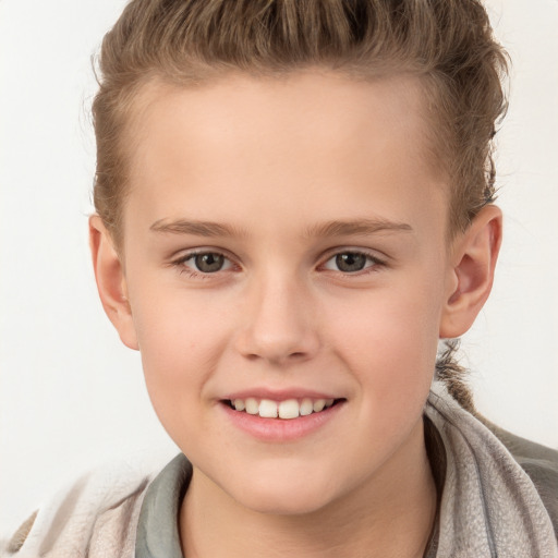 Joyful white child female with short  brown hair and brown eyes