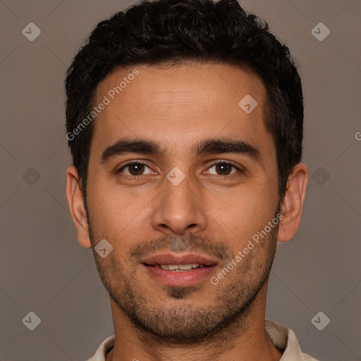 Joyful white young-adult male with short  black hair and brown eyes