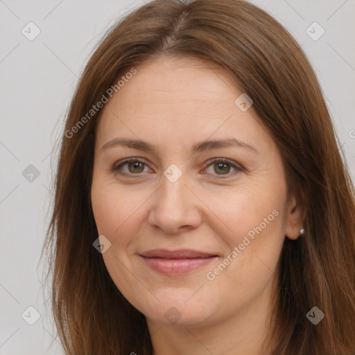 Joyful white adult female with long  brown hair and brown eyes