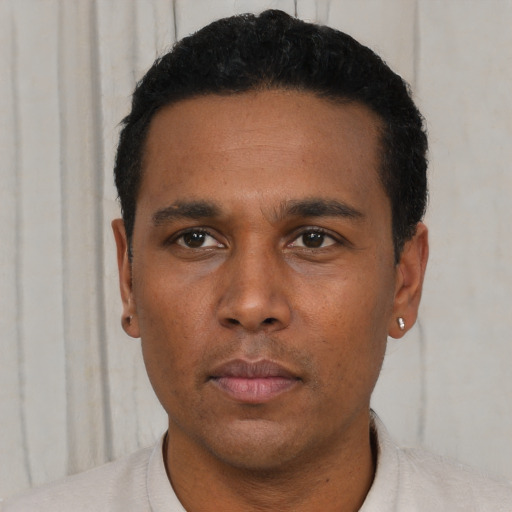 Neutral latino young-adult male with short  black hair and brown eyes