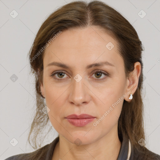 Joyful white adult female with medium  brown hair and grey eyes