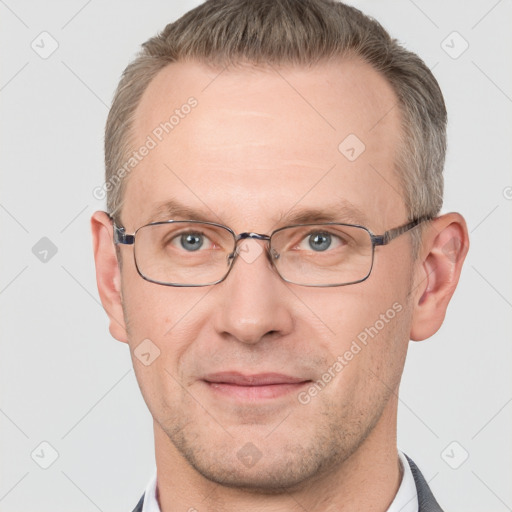 Joyful white adult male with short  brown hair and grey eyes