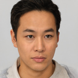 Neutral asian young-adult male with short  brown hair and brown eyes