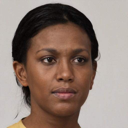 Neutral black young-adult female with short  black hair and brown eyes