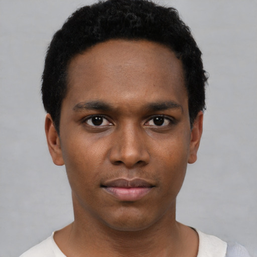 Neutral black young-adult male with short  black hair and brown eyes