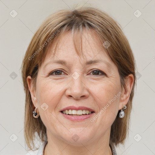 Joyful white adult female with medium  brown hair and grey eyes