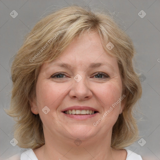 Joyful white adult female with medium  brown hair and blue eyes