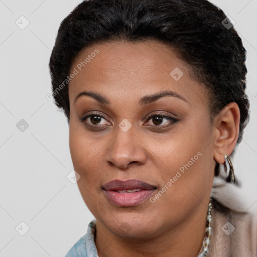 Joyful black young-adult female with short  brown hair and brown eyes