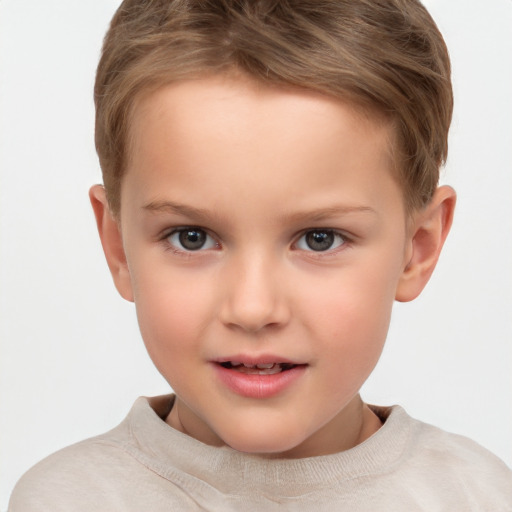 Joyful white child male with short  brown hair and brown eyes