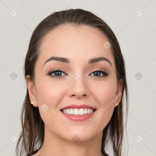 Joyful white young-adult female with long  brown hair and grey eyes