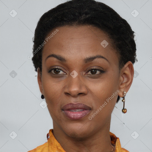 Joyful black young-adult female with short  brown hair and brown eyes