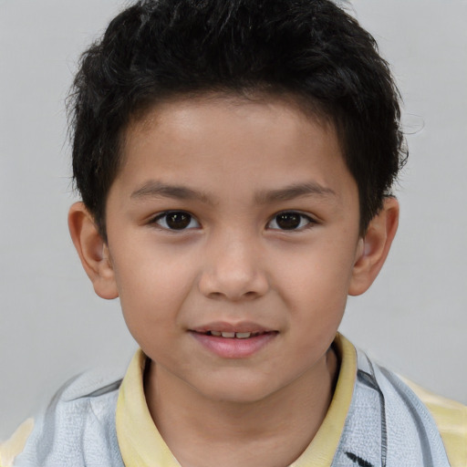 Joyful white child male with short  brown hair and brown eyes