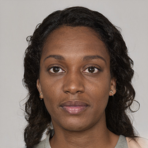 Neutral black young-adult female with long  brown hair and brown eyes
