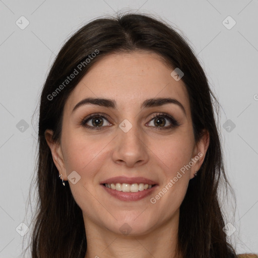 Joyful white young-adult female with long  brown hair and brown eyes