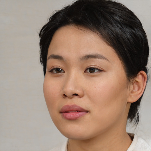 Neutral asian young-adult female with medium  brown hair and brown eyes