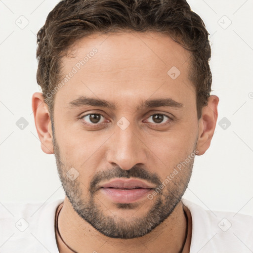 Joyful white young-adult male with short  brown hair and brown eyes