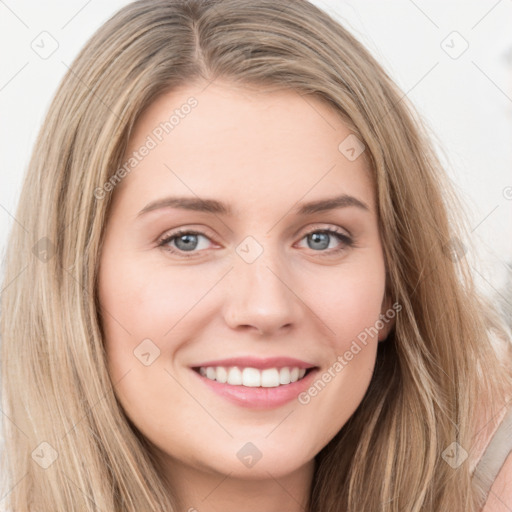 Joyful white young-adult female with long  brown hair and green eyes