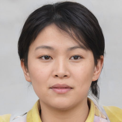 Neutral asian young-adult female with medium  brown hair and brown eyes