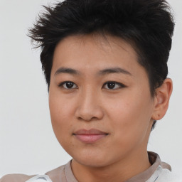 Joyful asian young-adult female with short  brown hair and brown eyes