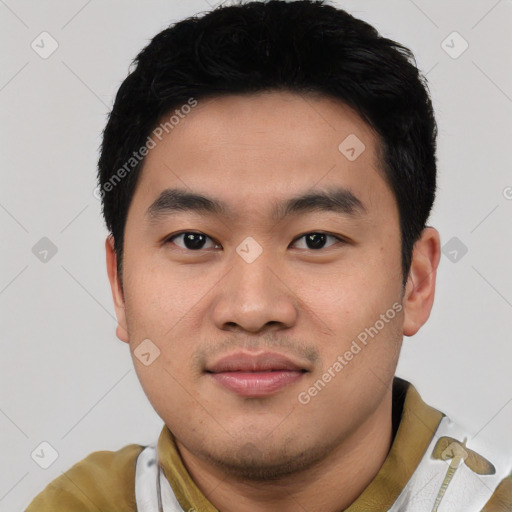 Joyful asian young-adult male with short  black hair and brown eyes