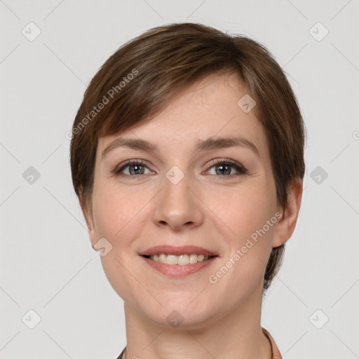 Joyful white young-adult female with short  brown hair and grey eyes