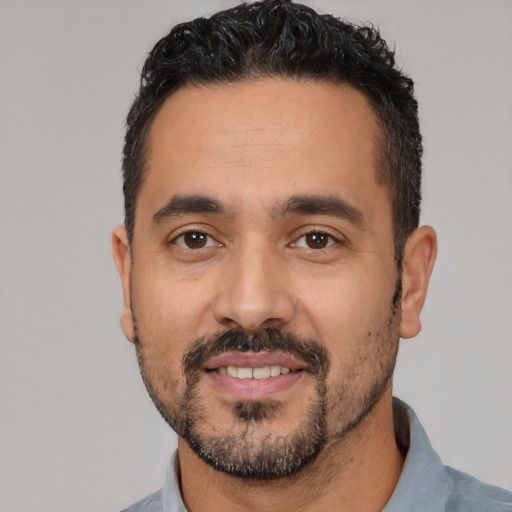 Neutral latino adult male with short  black hair and brown eyes