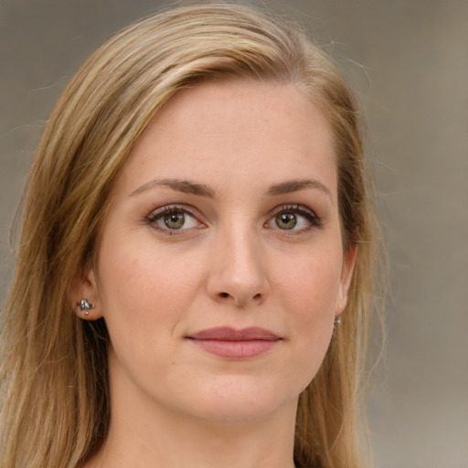 Joyful white young-adult female with long  brown hair and green eyes