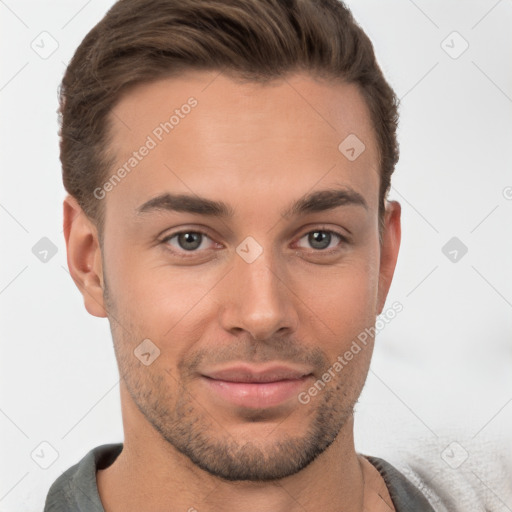 Joyful white young-adult male with short  brown hair and brown eyes