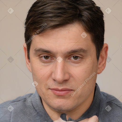 Joyful white adult male with short  brown hair and brown eyes