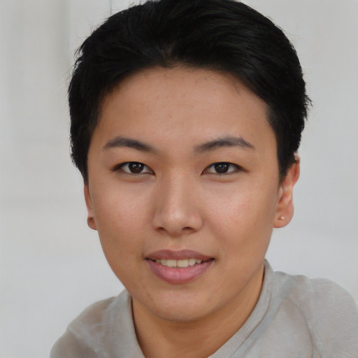 Joyful asian young-adult female with short  black hair and brown eyes