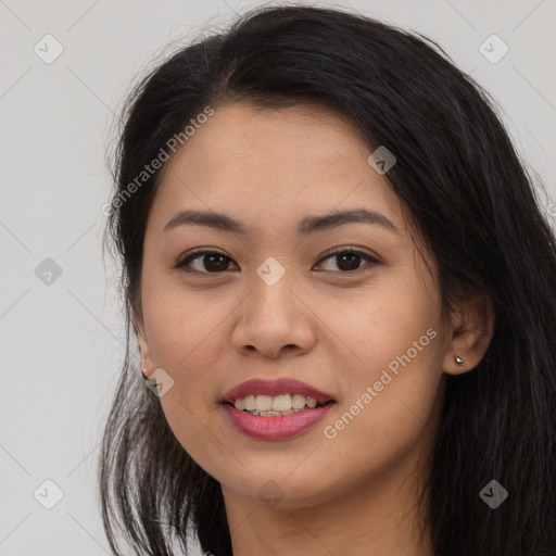 Joyful asian young-adult female with long  brown hair and brown eyes