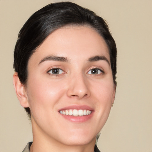 Joyful white young-adult female with medium  brown hair and brown eyes