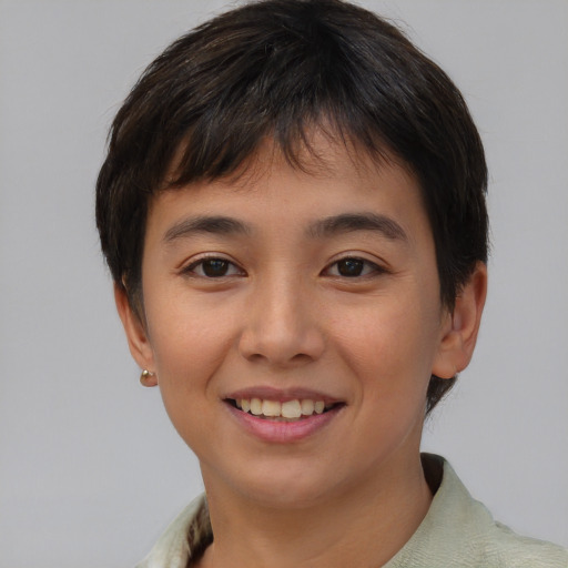 Joyful asian young-adult female with short  brown hair and brown eyes