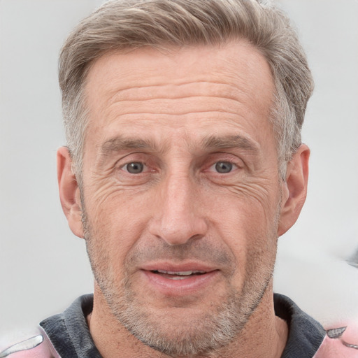 Joyful white adult male with short  gray hair and grey eyes