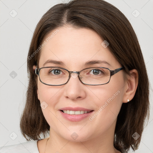 Joyful white young-adult female with medium  brown hair and grey eyes