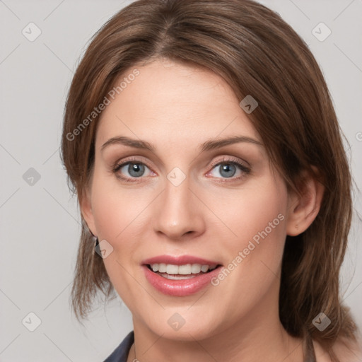 Joyful white young-adult female with medium  brown hair and blue eyes