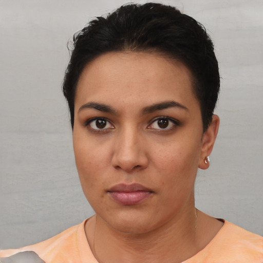 Neutral white young-adult female with short  black hair and brown eyes