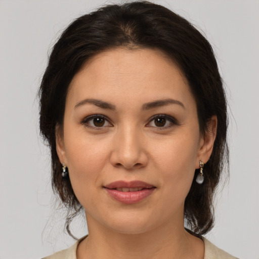 Joyful white young-adult female with medium  brown hair and brown eyes