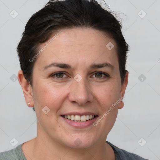 Joyful white adult female with short  brown hair and grey eyes