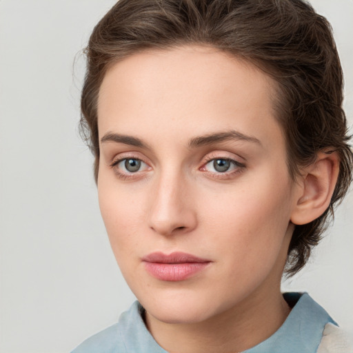 Neutral white young-adult female with medium  brown hair and green eyes