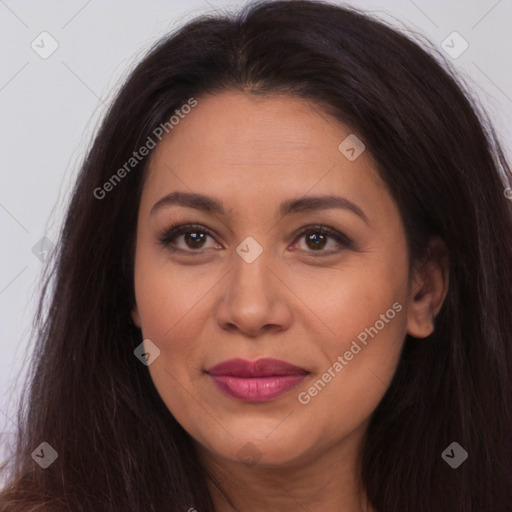 Joyful latino young-adult female with long  brown hair and brown eyes