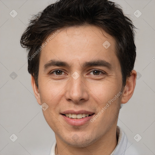 Joyful white adult male with short  brown hair and brown eyes