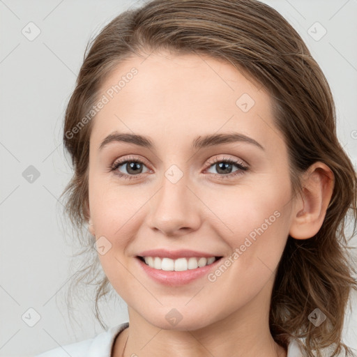 Joyful white young-adult female with medium  brown hair and blue eyes