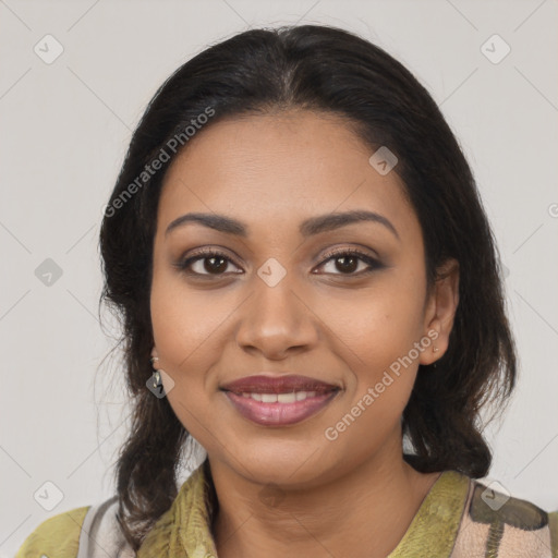 Joyful black young-adult female with medium  brown hair and brown eyes