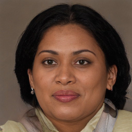 Joyful asian adult female with medium  brown hair and brown eyes