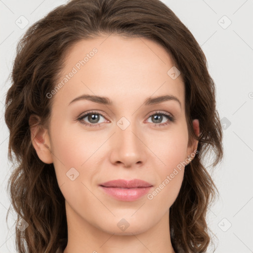 Joyful white young-adult female with long  brown hair and green eyes