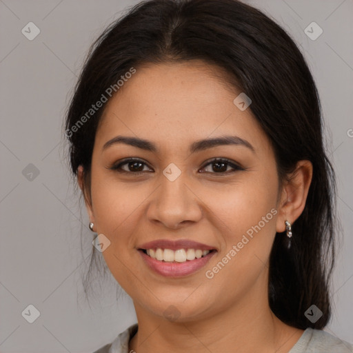 Joyful latino young-adult female with medium  brown hair and brown eyes