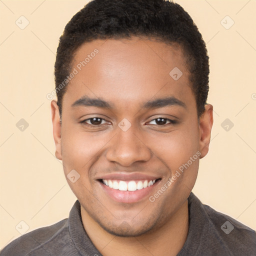 Joyful black young-adult male with short  brown hair and brown eyes